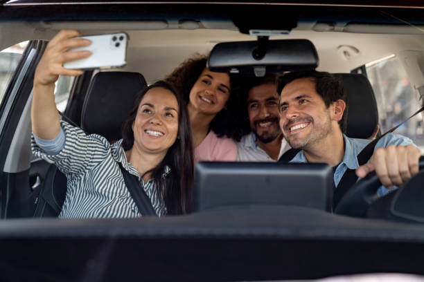 istock Friends taking a selfie in the car while going on a road trip 2163991704