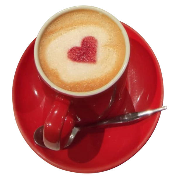 This photo features a beautifully crafted latte with a heart-shaped design in the foam, served in a vibrant red cup and saucer. The red heart in the center of the foam adds a charming touch, making it perfect for a cozy coffee moment.