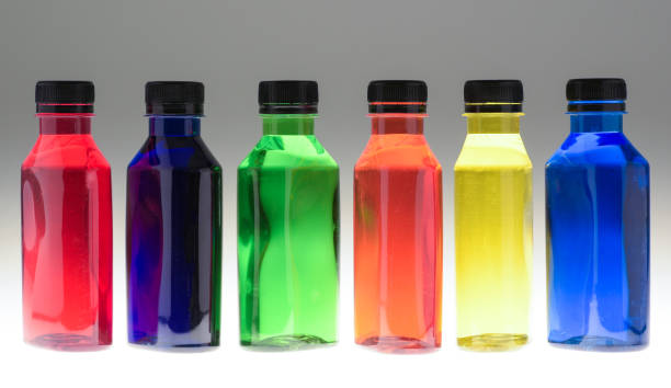 istock Bright coloured plastic bottles with colourful liquid showing colour changes has light passes through them 2163992904