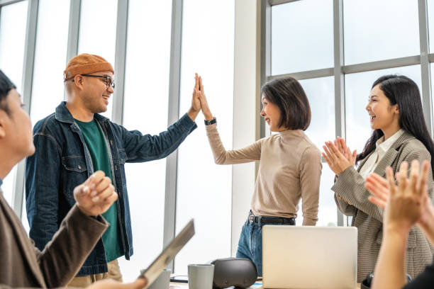 istock Asian business start up freelance people team analyzing statistics financial. Group Team of businesspeople man and woman Meeting Conference Discussion various topic Corporate Concept in office. 2163997523