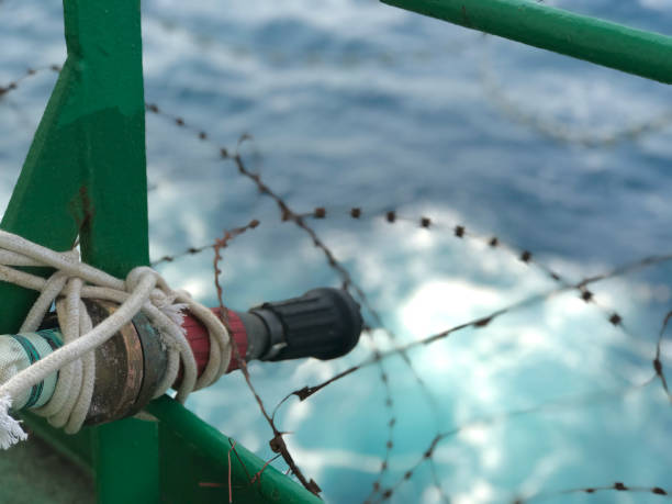 istock fire hoses fitted on the decks of a merchant ship 2164002489