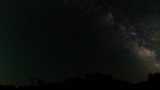 istock Starry night sky with Milky Way above observatory silhouette. 2164002794