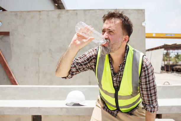 istock Senior engineer take a break and drinks water during working in heat day. 2164004586