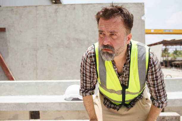 istock Senior engineer take a break and drinks water during working in heat day. 2164004587