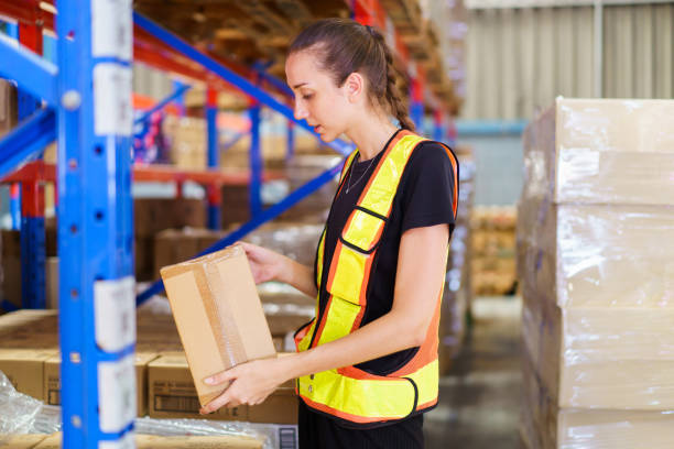 istock Female caucasian white warehouse worker inspecting the inventory. 2164004742
