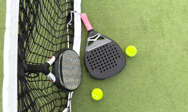 istock paddle rackets on the playing court 2164005419
