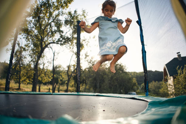 istock Beautiful girl enjoying summer on trampoline 2164006638