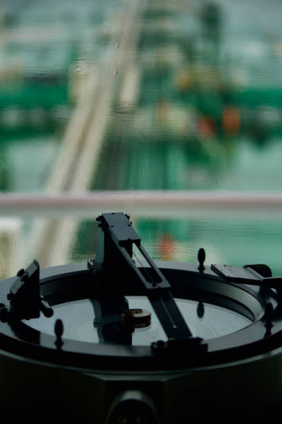 Closeup view of gyro compass with azimuth circle fitted on board the bridge of a ship at sea