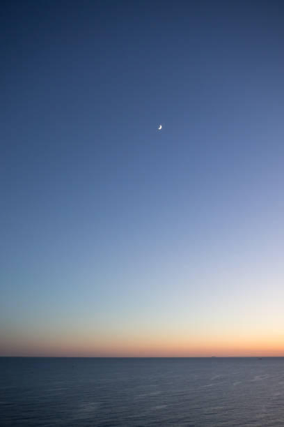 istock Moon at Sunset on Sea 2164007374