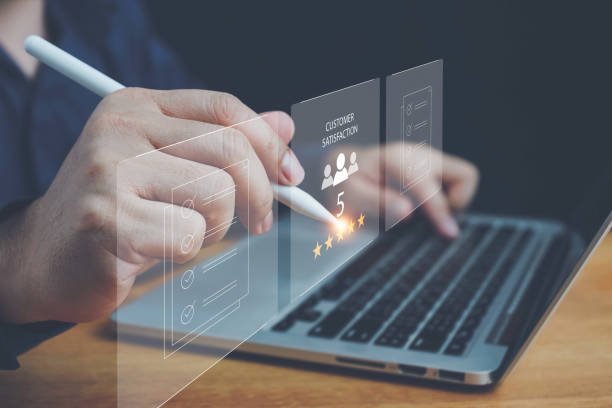 istock User gives rating to service experience on online application, Customer review satisfaction feedback survey concept, Customer can evaluate quality of service leading to reputation ranking of business. 2164007588