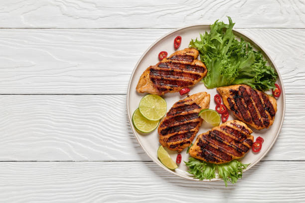 istock grilled chicken breasts wrapped in bacon on plate 2164008427