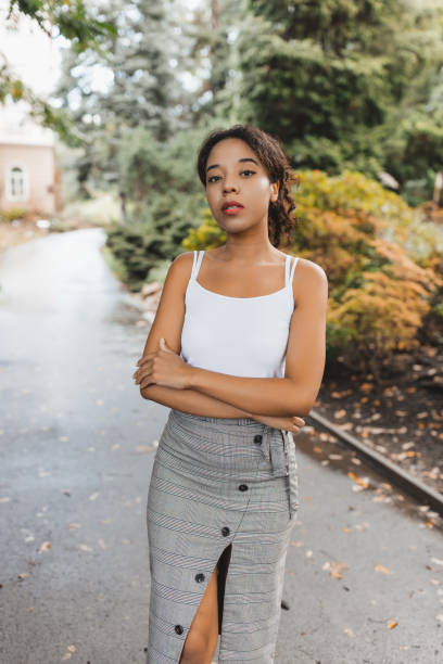 istock Confident Woman in Stylish Outfit Posing Outdoors in Fall 2164009131