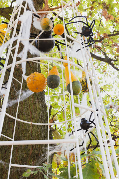 Halloween Tree Decor with Pumpkins, Spiderwebs, and Fake Spiders