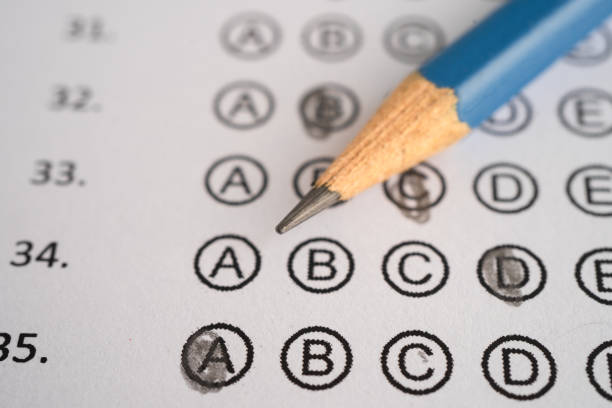 istock Answer sheets with pencil drawing fill to select choice, education concept. 2164011665