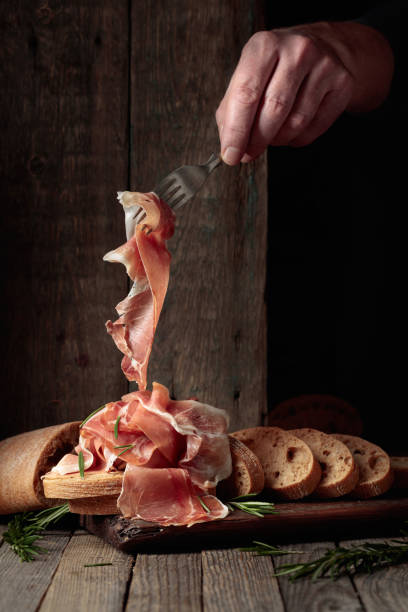 istock The hand of a prosciutto thief. 2164015699