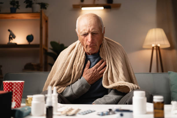 istock Senior man with pneumonia symptoms at home 2164017754