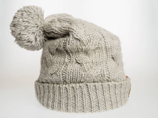 istock Gray knitted hat on a white background, a stylish and warm accessory for cold weather, suitable for any wardrobe 2164020042