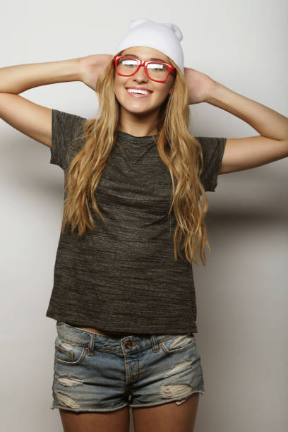 istock young hipster blonde woman with glasses 2164020367