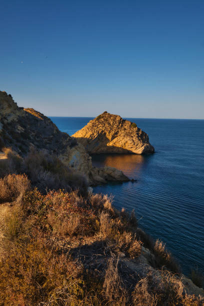 istock rocky bay calm blue sea 2164020558