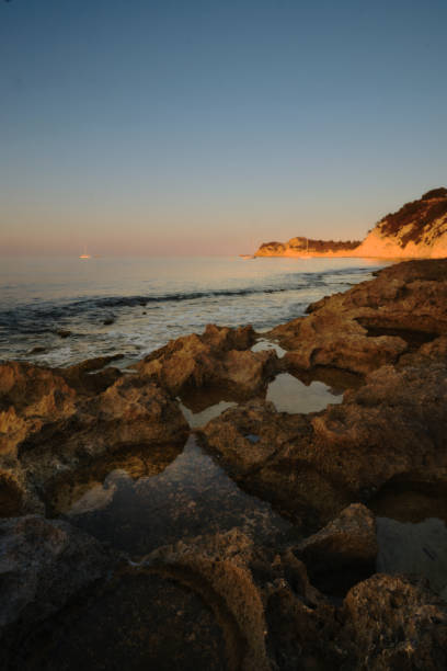 istock seascape rocky beach at sunset 2164020780