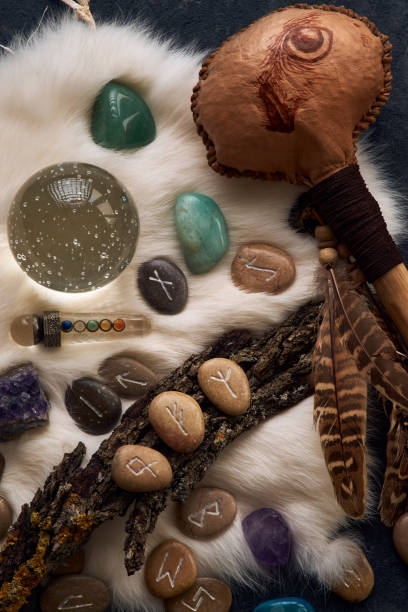istock handmade stone runes on white fur 2164020985