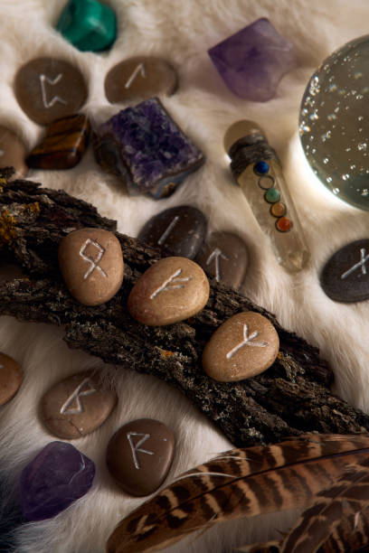 istock handmade stone runes on white fur 2164021009