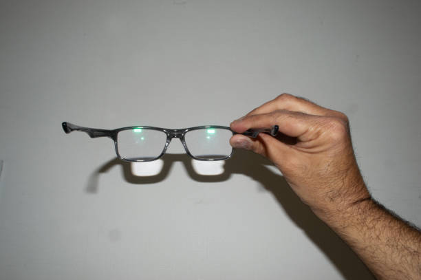 istock a hand holding presbyopic glasses 2164021950