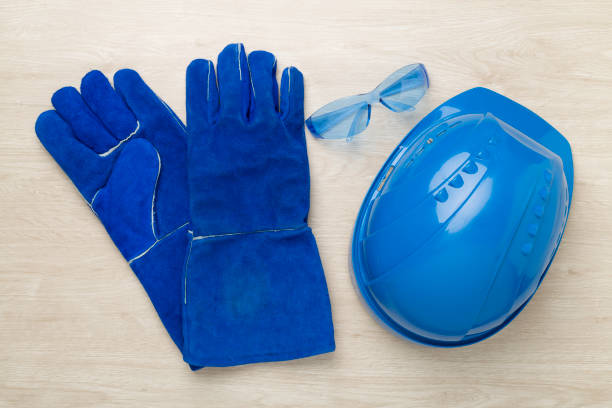 Blue construction equipment on wooden background, top view