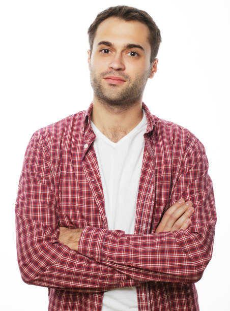 life style and people concept: Handsome young man in shirt looking at camera