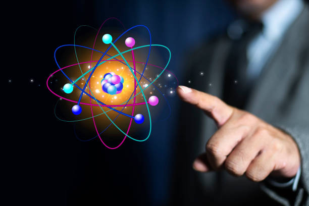 istock Bussinessman finger pointing creative atom on blue background. Nuclear fusion concept, endless energy, cheap electricity, future technologies. Science and future concept 2164029778