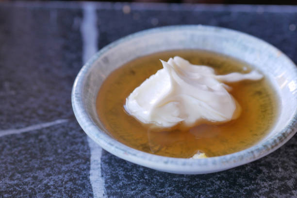 istock butter cream and honey in a bowl on table . 2164031300