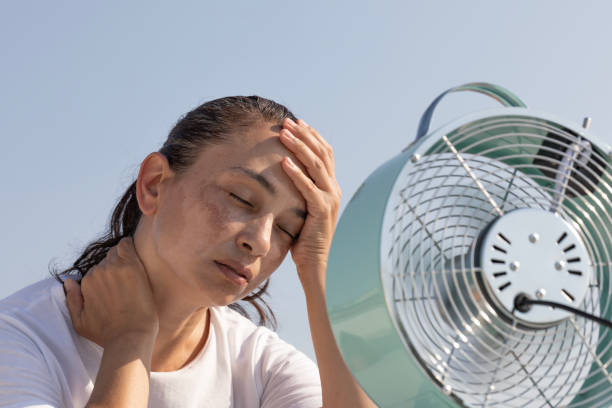 istock Woman with Fan 2164032254