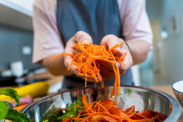 istock Chef at the kitchen preparing spicy glass noodle salad 2164033180