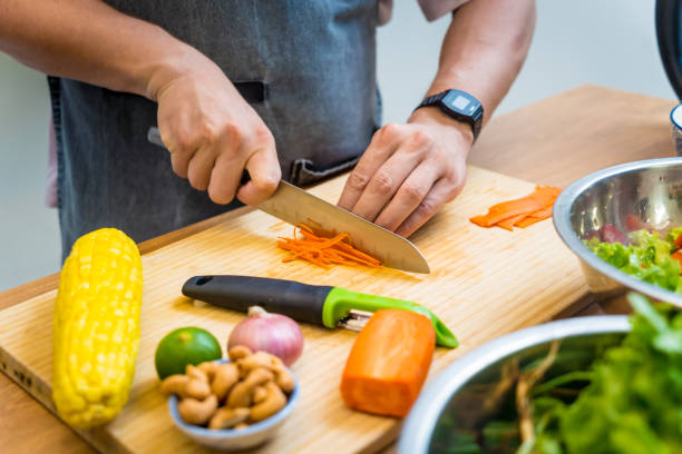 istock Chef at the kitchen preparing spicy glass noodle salad 2164033402