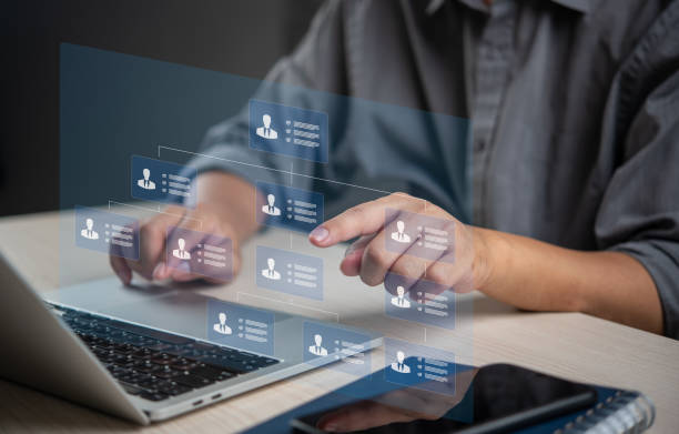istock Person managing digital organizational chart on a laptop, indicating structured business management and HR processes. Suitable for corporate, HR, and management content. 2164034411