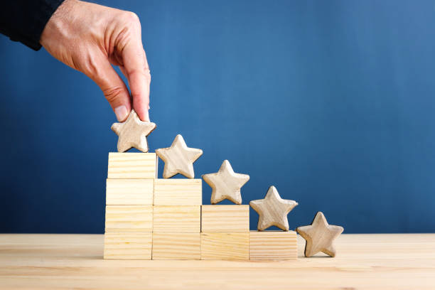 istock concept image of setting a five star goal. increase rating or ranking, evaluation and classification idea 2164034900