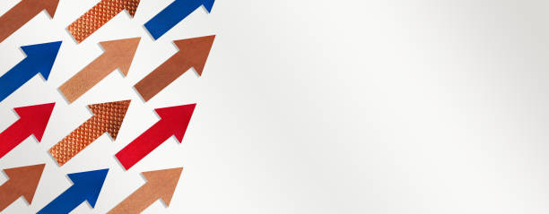 istock Paper arrows of different colors and textures on gray white gradient background. Copy space 2164038478