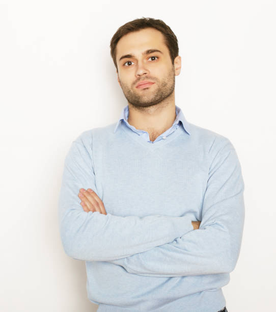 istock happy young man in blue shirt. 2164041524