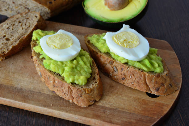 istock a slice of bread with eggs and avocado on it close up 2164050513