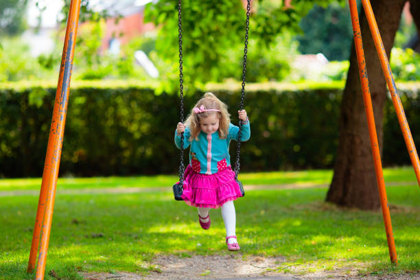 Kids explore nature. Children play in sunny park.