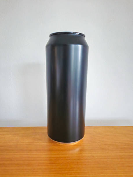 istock Black aluminium can on wooden table. 2164051924
