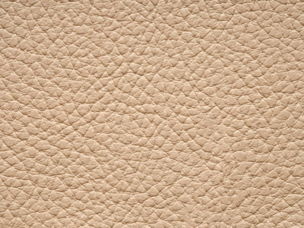 istock Light beige matte background of suede fabric, closeup. 2164051987