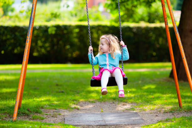 istock Kids explore nature. Children play in sunny park. 2164052150