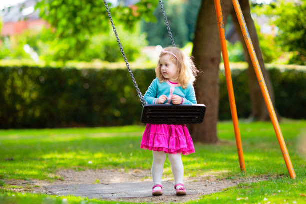 istock Kids explore nature. Children play in sunny park. 2164052184