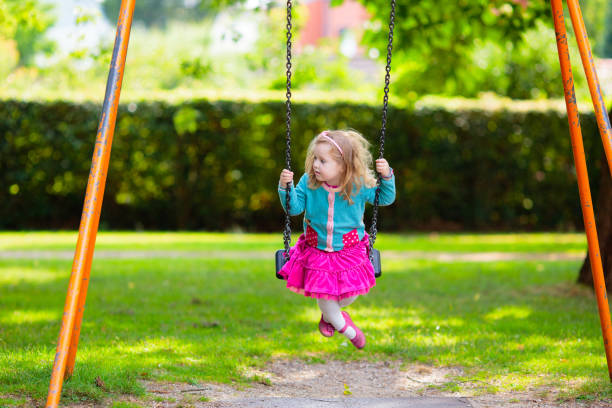 istock Kids explore nature. Children play in sunny park. 2164052423