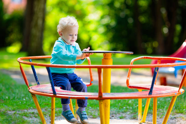istock Kids explore nature. Children play in sunny park. 2164052447