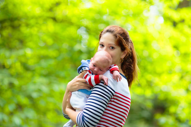istock Mother and baby in a park 2164052478