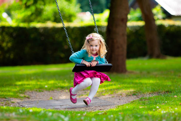 istock Kids explore nature. Children play in sunny park. 2164052562