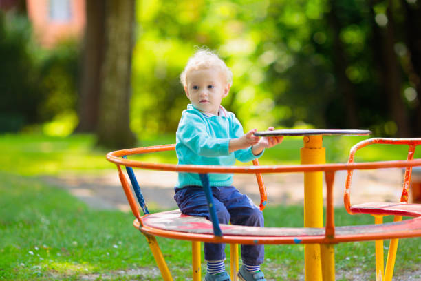 Kids explore nature. Children play in sunny park.