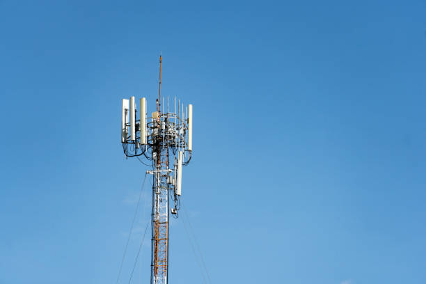 istock Telecommunications tower with multiple antennas and dishes against a clear blue sky,providing wireless network connectivity and data transmission for mobile devices,internet,and communications. 2164052655